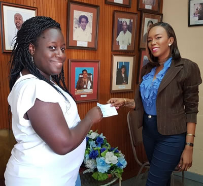 In Photo: Marlene Edwards Dillon (left) collects settlement cheque received from private employer, given by Tonia Gomez (TTRNA - Office Administrator).