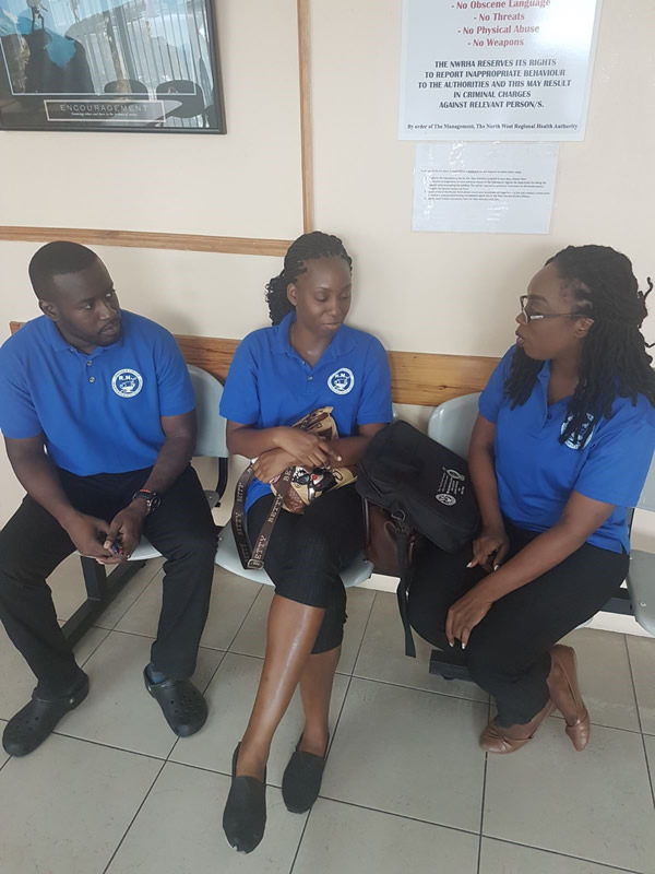  Chair of the Northern Branch Ms. Letitia Cox in discussion with staff representative Jeremy Walkes at far right and Keisha Williams NWRHA head office Monday 3rd April 2017.